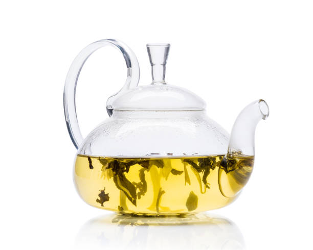 istock Glass teapot with green tea 1255026170