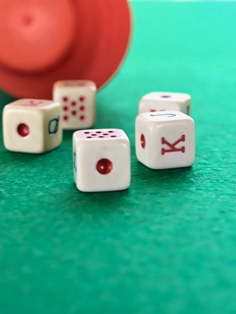 istock Poker dice game on a green tablecloth 1255027893
