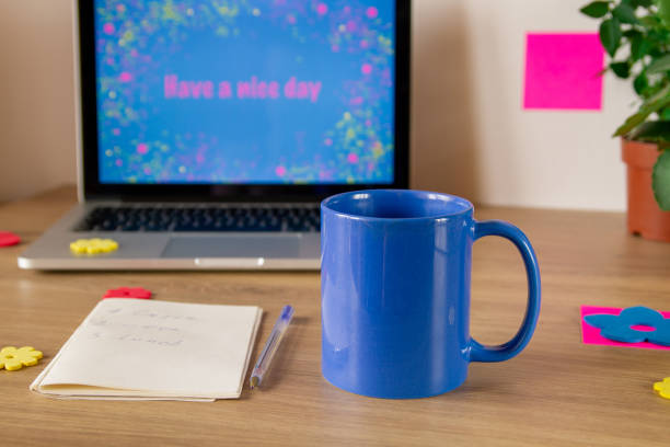 istock Notebook. Lettering Have a nice day. A cup of coffee in blue. Notepad with daily routine. 1255029556