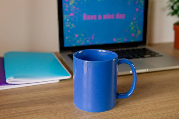 istock Notebook. Lettering Have a nice day. A cup of coffee in blue. 1255029578