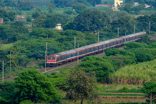Pune, India -November 10 2019:  A local commuter train in the countryside at Yavat near Pune India.