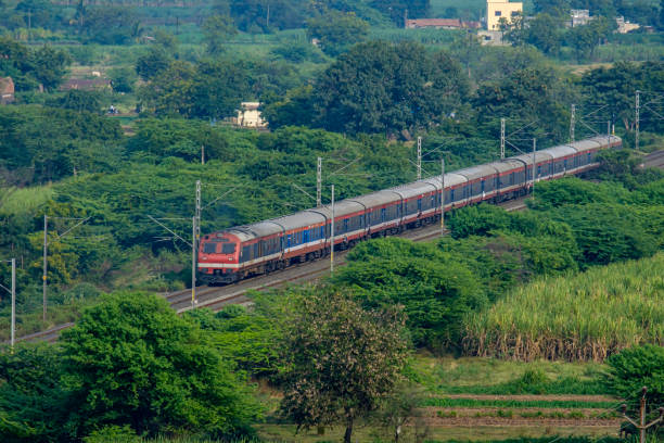 Commuter Trains India Pune, India -November 10 2019:  A local commuter train in the countryside at Yavat near Pune India. commuter train photos stock pictures, royalty-free photos & images
