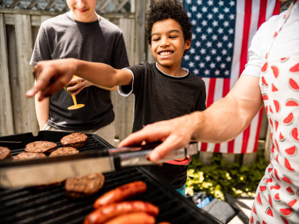 istock Burger line up at 4th July BBQ 1255031067