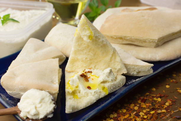 istock Syrian bread with quark quark cheese snacks in a platter in wood background 1255031074