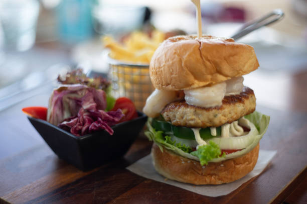 istock hamburger with Side dishes on the table 1255033597