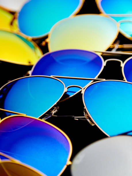 istock Sunglasses with colorful lenses on black background 1255033701