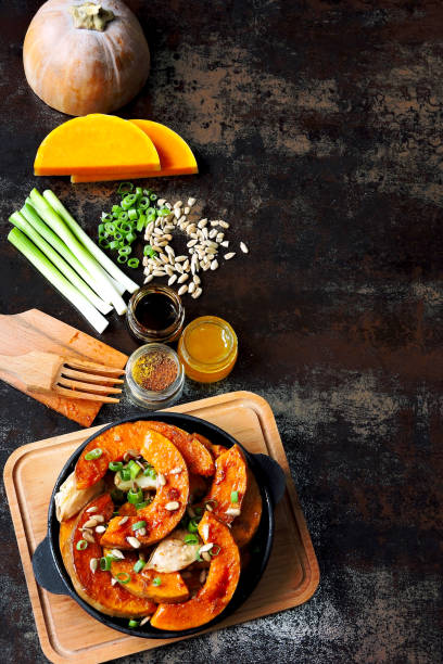 istock Baked pumpkin slices in a small cast iron skillet. 1255034823