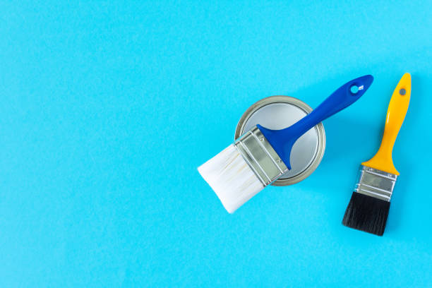 istock Can of white paint with brushes 1255035387