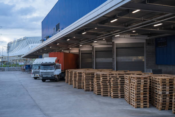 istock Truck is carrying container parking in front warehouse 1255035580