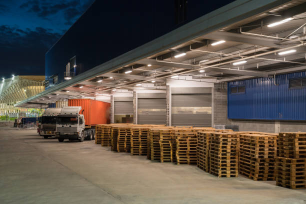 istock Truck is carrying container parking in front warehouse 1255035614