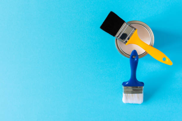 istock Can of white paint with brushes 1255035730