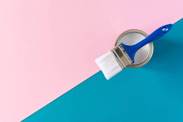 istock Can of white paint with a brush 1255035731
