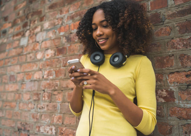 istock Afro-American woman using mobile phone. 1255036856