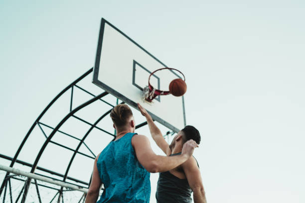 istock Young basketball players playing one-on-one. 1255036880