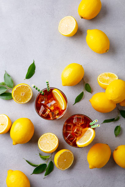 istock Lemon ice tea, lemonade. Grey background. Copy space. Top view. 1255039985
