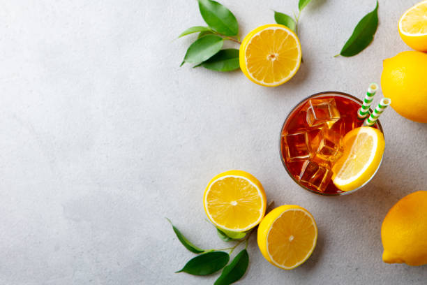 istock Ice tea with fresh lemons. Grey background. Copy space. Top view. 1255041819