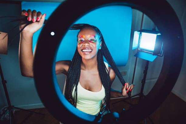 istock Millennial Influencer streaming a video conference live on her social channels 1255042912