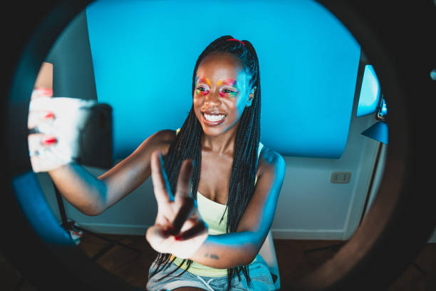 istock Millennial Influencer streaming a video conference live on her social channels 1255044391