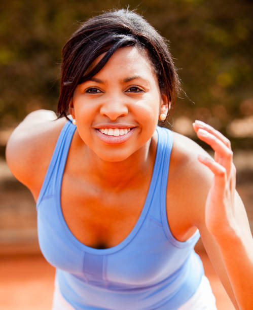 istock Black female athlete looking happy 1255048854