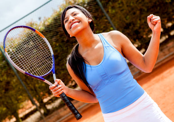 istock Happy tennis player celebrating she scored 1255048885