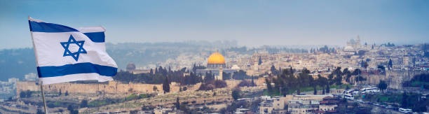 Israel flag above the old city of Jerusalem. stock photo