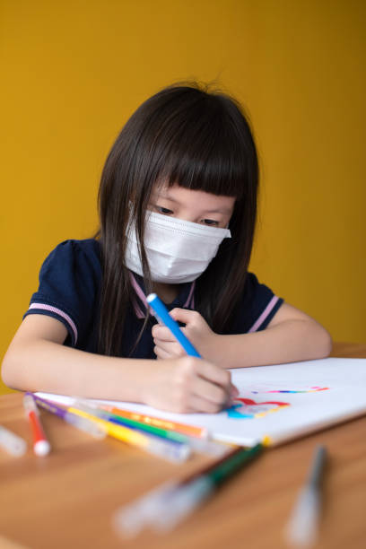 istock Little girl drawing and exploring her creativity at home 1255059420