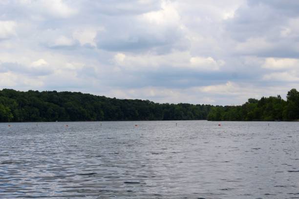 istock White Clouds over Calm Lake Waters 1255060294