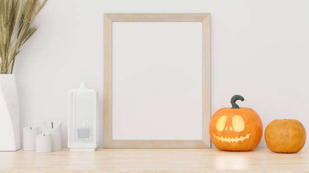 istock Photo frame mockup on table with halloween decoration 1255060351