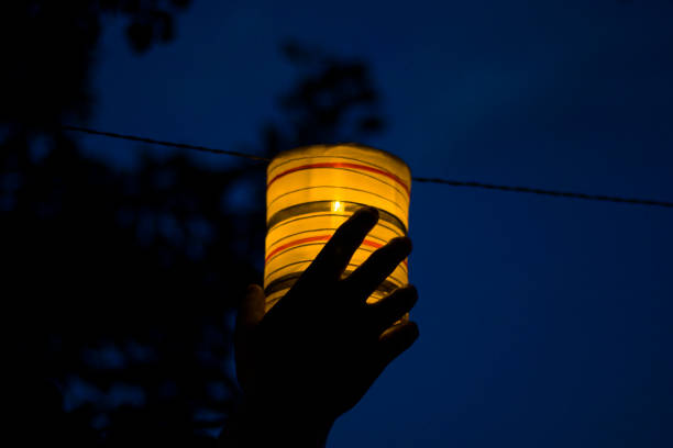 istock Lantern in the yard, night and warm light, hanging lanterns, natural light, evening time. 1255063902