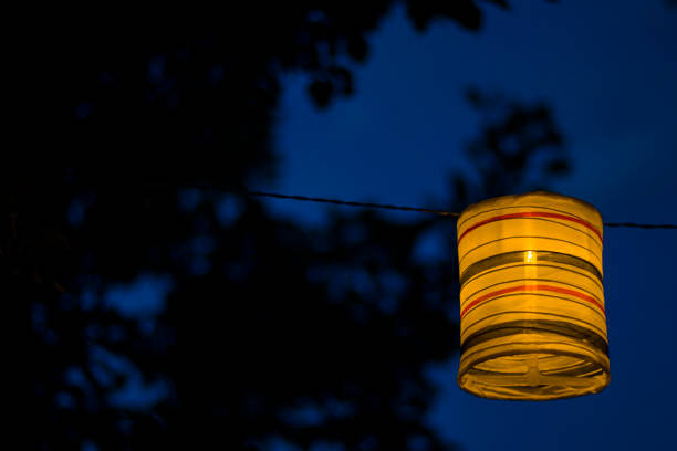 istock Lantern in the yard, night and warm light, hanging lanterns, natural light, evening time. 1255063936