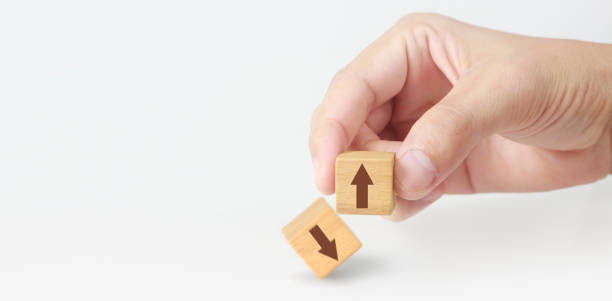 istock Concept creative idea  innovation. wooden cube block in hand with symbol 1255066635