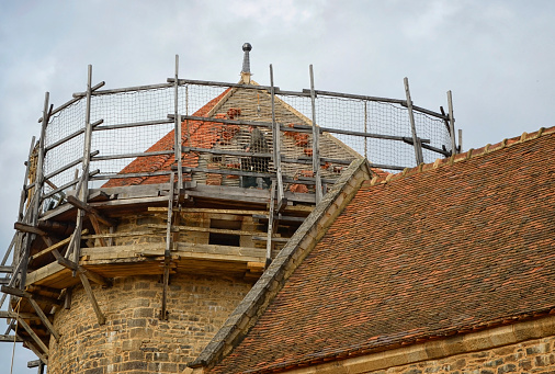 Treigny, France: Guedelon Castle is being constructed using 13th century techniques as an archaeological experiment. The idea began in 1996 and since 1998 the public has been able to enter the site to view construction and the fabrication of materials. The roof tiles are handmade on site and installed one by one.