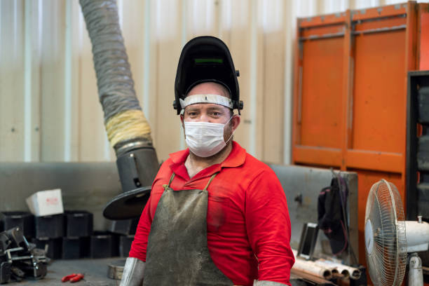 Portrait of industrial welder Portrait of industrial welder welding helmet stock pictures, royalty-free photos & images