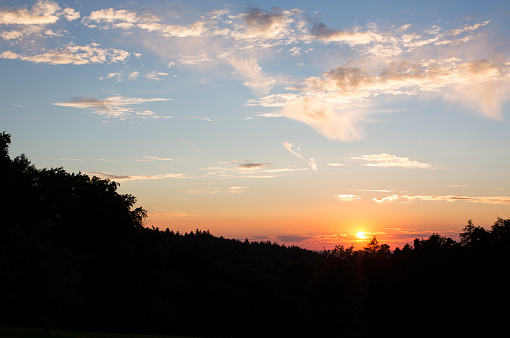 Moody sunset over rural landscape