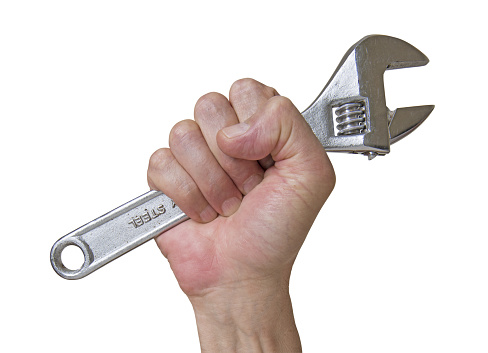 Man hand holding a wrench on white background