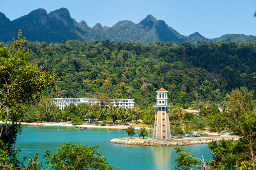 Langkawi, officially known as Langkawi, the Jewel of Kedah, is a district and an archipelago of 99 islands in the Andaman Sea some 30 km off the mainland coast of northwestern Malaysia. The islands are a part of the state of Kedah, which is adjacent to the Thai border.