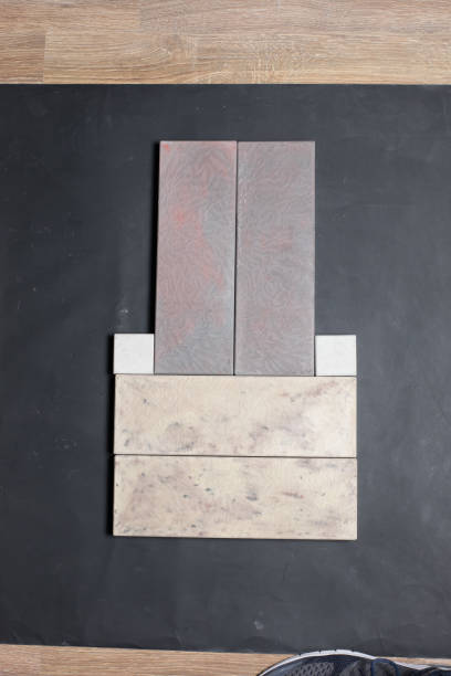istock A sample of ground, wall stone shape on the unicolour background 1255079802
