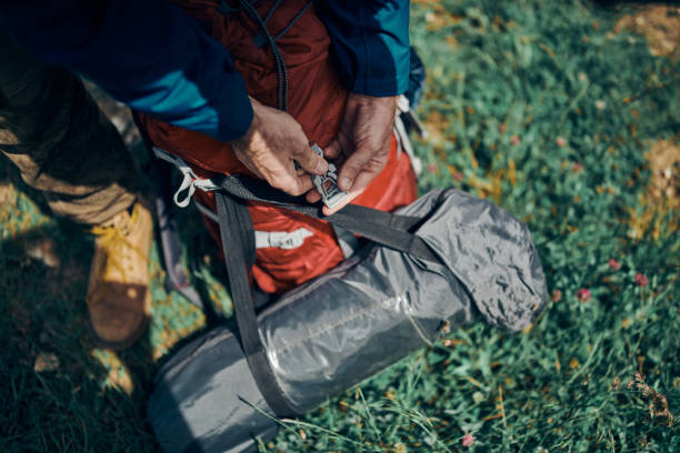 istock Closeup of man buckling up his backpack. 1255080272