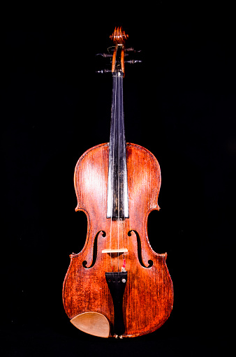 Classical shape wood vintage violin Music instrument isolated on Black background