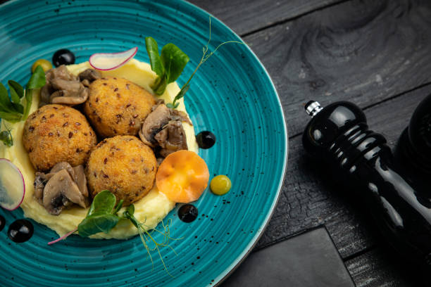 istock round meatballs with mashed potatoes and grilled vegetables 1255081692