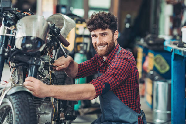 istock Happy man with his motorcycle 1255081988