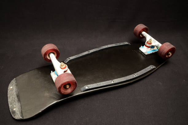 istock Old Used Wooden Skateboard 1255083420