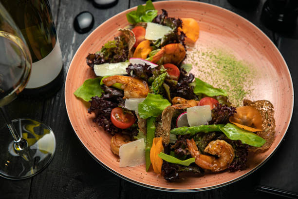 istock Salad with seafood, asparagus, tomatoes, 1255085216