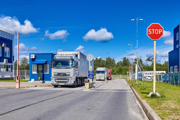 Trailer brought import to customs bonded warehouse St. Petersburg, Russia - July 27, 2017: Trucks with trailers at a checkpoint of a customs terminal. Freight forwarders delivered imported cargo to custom bonded warehouse for temporary storage. customs agent stock pictures, royalty-free photos & images