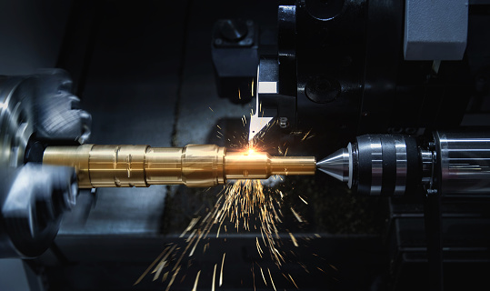 1. Metal machine tools industry. CNC turning machine high-speed cutting is operation.flying sparks of metalworking
