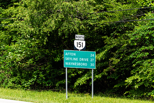 Langley, VA, USA - July 19, 2017: A road sign pointing the way to the CIA Headquarters complex. The George Bush Center for Intelligence is the headquarters of the Central Intelligence Agency.