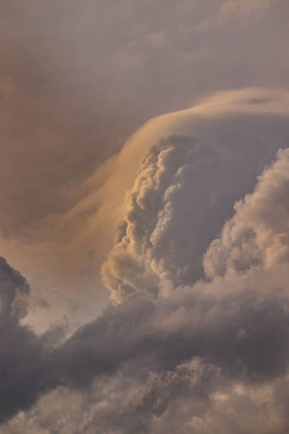 istock large cumulus cloud shrouded in a fine mist, floating under the twilight sky. 1255098798
