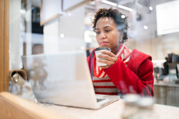 Woman on laptop working.
