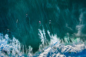 Drone view of a group of surfers in Bali Indonesia