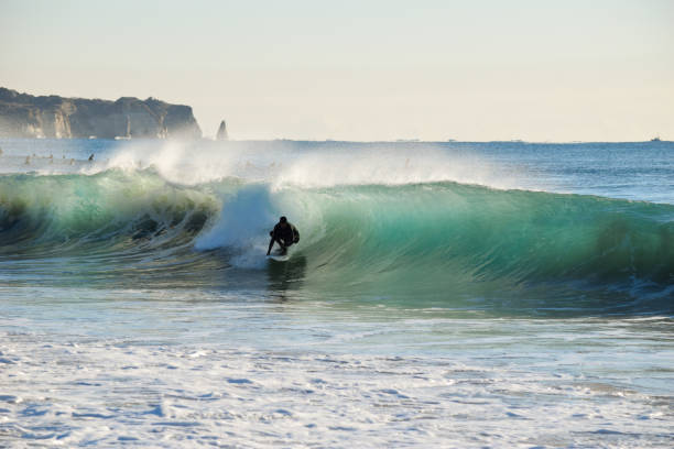 istock Surfer on Blue & green Ocean Wave riding a surfboard 1255102507